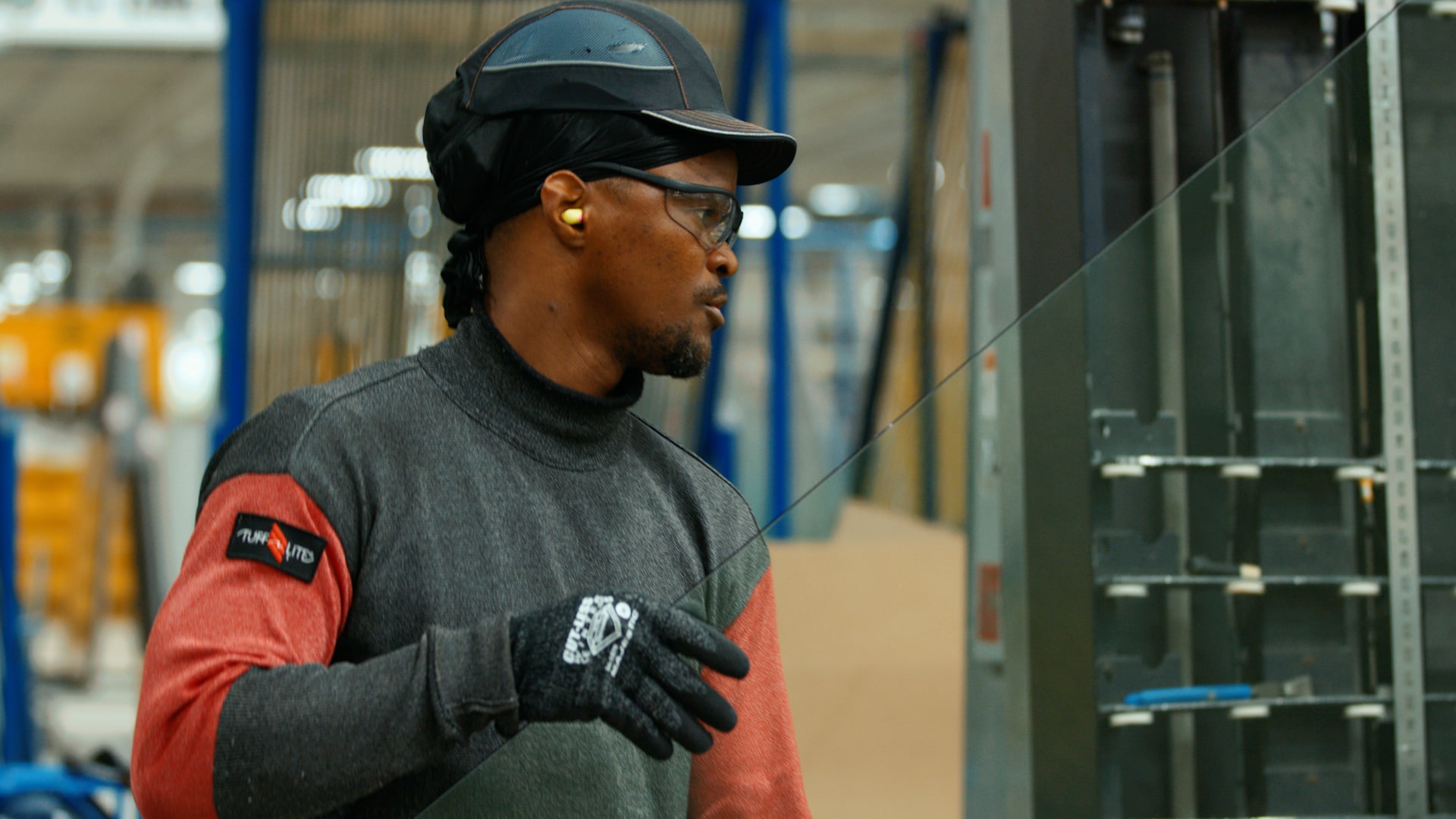 cardinal fargo employee holding a piece of glass